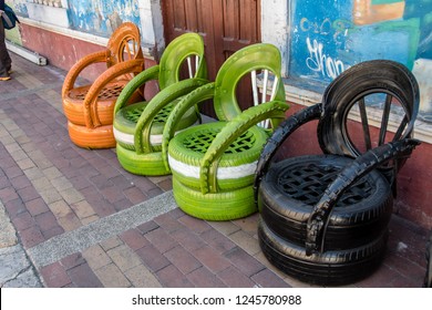 GUANO, RIOBAMBA, ECUADOR - OCT 17,2018 : old tires are recycled and reused to create nice garden chairs, in Guano, near Riobamba on October 17, 2018.
