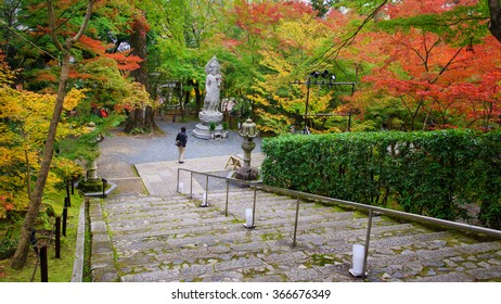 Guanyin Statue And Autumn Garden At Eikando Temple In Kyoto, Japan