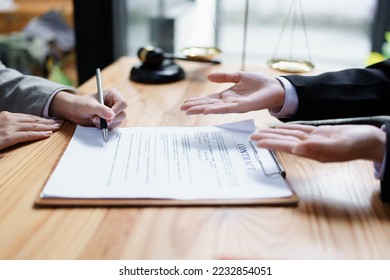 Guarantee, Mortgage, agreement, contract, Signing, Male client holding pen to reading agreement document to sign land loan with real estate agent or bank officer - Shutterstock ID 2232854051