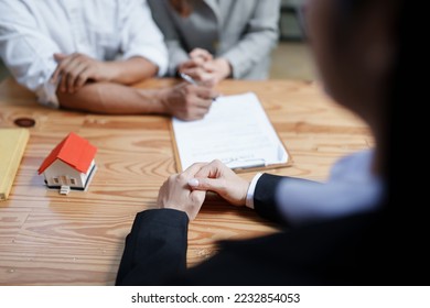 Guarantee, Mortgage, agreement, contract, Signing, Male client holding pen to reading agreement document to sign land loan with real estate agent or bank officer - Shutterstock ID 2232854053