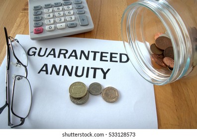 Guaranteed Annuity With Coins On Paper And In Pot And Calculator Behind