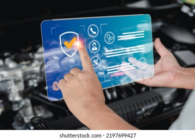 Guaranteeing The Quality Of Service Of Car Repairs, Service Man Point On  Virtual Screen Warranty Of Car Repair And Quality Check On Smart Checklist With Car Engine Room In Background