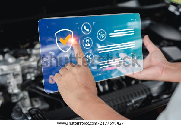 Guaranteeing\
the quality of service of car repairs, service man point on \
virtual screen warranty of car repair and quality check on smart\
checklist with car engine room in\
background