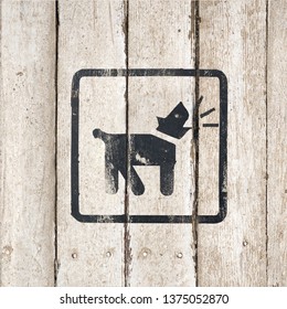 Guard Dog Inside Icon. Dog Barking Icon. Button Image On Wooden Background. Barking Dog Silhouette In Black Color. Barking Dog Sign On A White Wooden Background. Part Of A Series