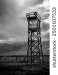 A guard tower stands at the perimeter of Manzanar internment camp.