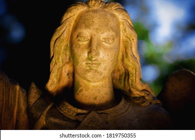 Guardian Angel Against Dark Background.. Close Up. Fragment Of An Antcient Statue.