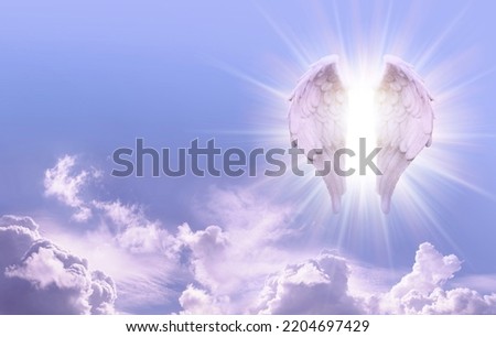 Guardian Angel Sky Message Banner - Beautiful sunny blue sky with a pair of glowing Angel Wings on one side and copy space for angelic messages
