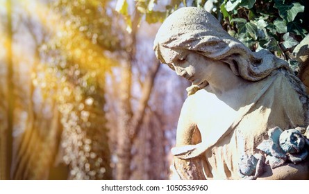 Guardian Angel Statue In Sunlight As A Symbol Of Strength, Truth And Faith.