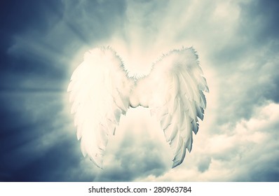 Guardian Angel White Wings Over Dramatic Grey With Light. Religion And Spiritual Concept