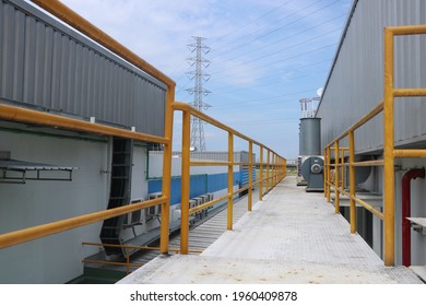 Guardrail walkway on the rooftop of an industrial plant