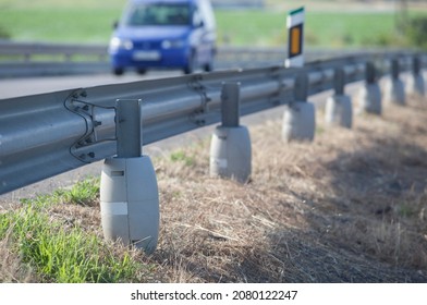 Guardrails poles covered with crash-absorber cylinder. Motorbikers safety concept