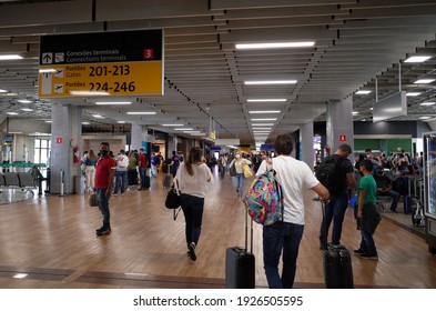 Guarulhos, São Paulo, Brazil - December 12 2020: People Wearing Mask Due To The New Coronavirus Covid-19 Pandemic At The Terminal Of São Paulo Guarulhos International Airport.