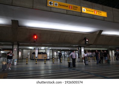 Guarulhos, São Paulo, Brazil - January 11 2021: People Waiting At The Crosswalk In Front Of Entrance Of São Paulo Guarulhos International Airport.