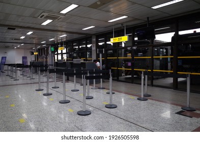 Guarulhos, São Paulo, Brazil - January 11 2021: Staff Worker At Empty Gate Of São Paulo Guarulhos International Airport.