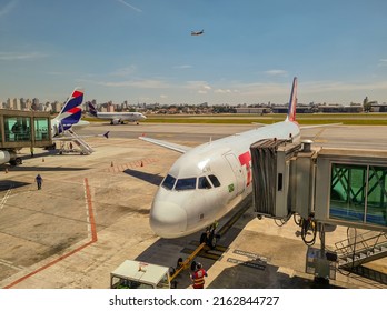 Guarulhos, São Paulo, Brazil - November 17, 2021: Airplane In The Passenger Terminal Of Sao Paulo International Airport