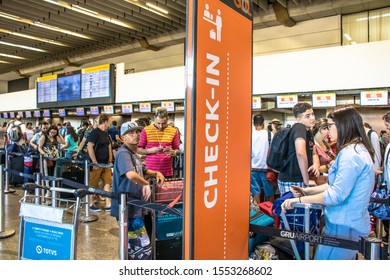 Guarulhos, SP, Brazil, December 27, 2016. Passengers At The Check-in Area In The Lobby Of André Franco Montoro International Airport, Cumbica Airport, In Guarulhos City.