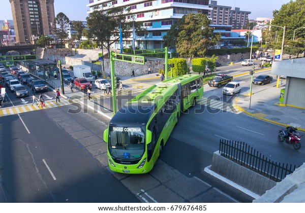 GUATEMALA CITY - March 27, 2017: Guatemala\
City, modern architecture and public transport in the morning\
people to work, central America.\
EDITORIAL.