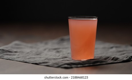 Guava Drink From Can Into Tumbler Glass On Table, Wide Photo