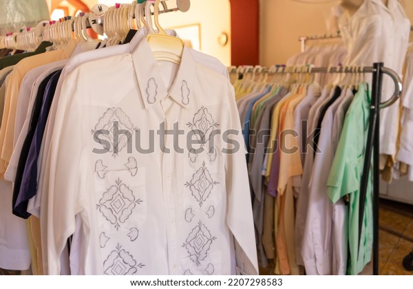 Guayabera shirts on display in an artisan\
sewing shop in Granada\
Nicaragua