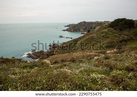 Guernsey south coast - a view across the cliffs to the water on a beautiful overcast day in the Channel Islands.