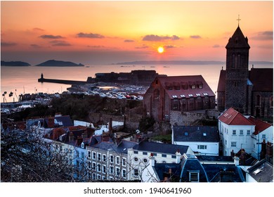 Guernsey's St Peter Port With Herm, Jethou And Sark On The Horizon