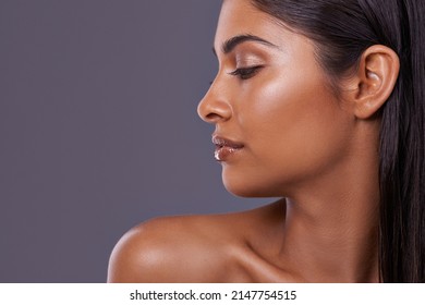 I Guess Beauty Does Have A Best Side. Cropped Shot Of A Beautiful Young Woman Posing In The Studio.