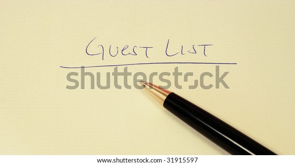guest list on a paper with
pen