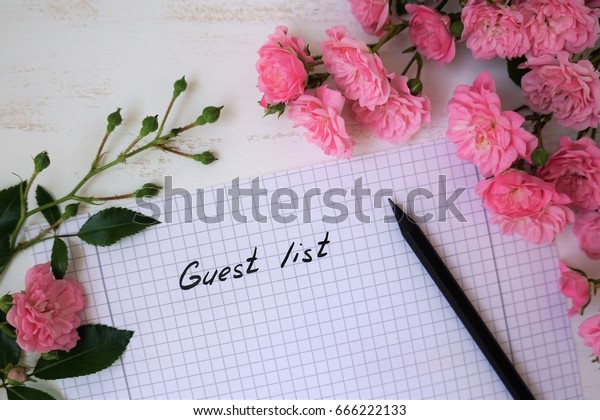 Guest list with small roses\
covered