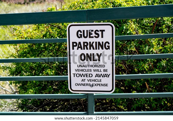 Guest parking only warning\
sign