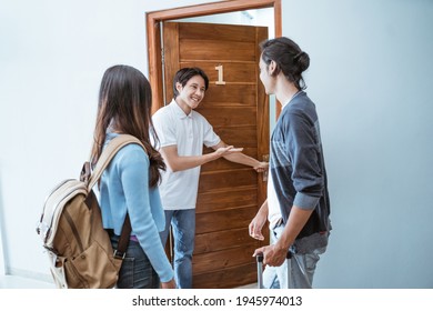 Guesthouse Staff Welcoming Guest In Boutique Hotel