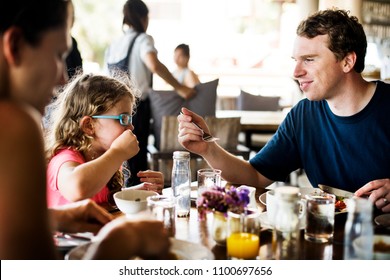 Guests Having Breakfast At Hotel Restaurant