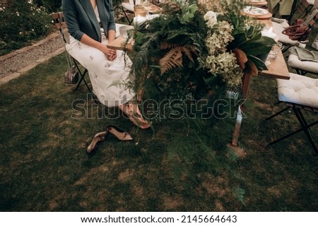 Similar – Woman holding vase with flowers