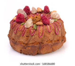 Gugelhupf Marble Bundt Cake, Filled With Dried Blackcurrant And Chestnut Paste, Garnished With Blackcurrant Icing, Marron Glace, Whole Almonds, Freeze-dried Raspberry, Pistachios, And Silver Dragees.