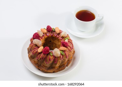 Gugelhupf Marble Bundt Cake, Filled With Dried Blackcurrant And Chestnut Paste, Garnished With Blackcurrant Icing, Marron Glace, Whole Almonds, Freeze-dried Raspberry, Pistachios, And Silver Dragees.