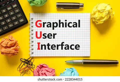 GUI graphical user interface symbol. Concept words GUI graphical user interface on white note on a beautiful yellow background. Business and GUI graphical user interface concept. Copy space.