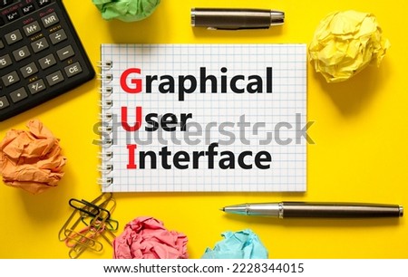 GUI graphical user interface symbol. Concept words GUI graphical user interface on white note on a beautiful yellow background. Business and GUI graphical user interface concept. Copy space.