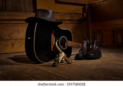 Guiatr for country music a hat and boots all you need to country dance.
