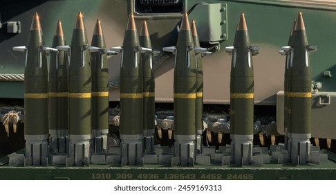 Guided 155 mm artillery ammunition on a howitzer battle position