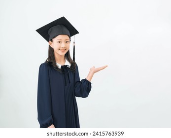 Guiding Asian little girl dressed as a doctor. - Powered by Shutterstock