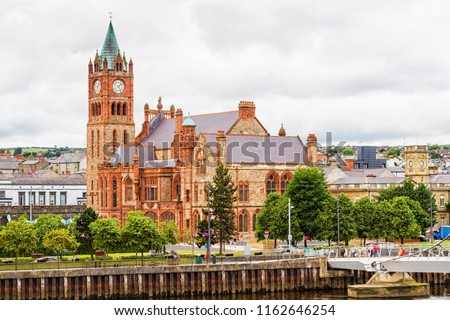 Guildhall in Derry by the Foyle river. Londonderry, Northern Ireland, United Kingdom.
