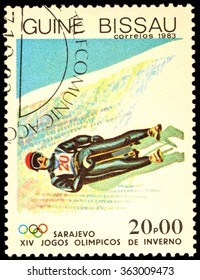 GUINEA-BISSAU - CIRCA 1983: Stamp Printed In Guinea-Bissau Shows Toboggan, Devoted To The 14th Winter Olympics In Sarajevo, Series, Circa 1983