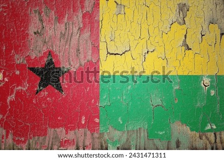 Guinea-Bissau flag and paint cracks. Prison concept with border image. Guinea-Bissau is currently heading toward recession. Inflation. employment. economic recession. Double exposure hologram