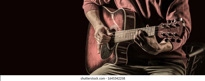 Guitar acoustic. Play the guitar. Instrument on stage and band. Music concept. Electric guitar, string, guitarist, musician rock. Musical instrument. Guitars and strings. Copy space.