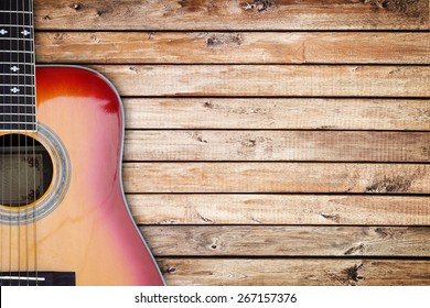 Guitar against a rustic wood background