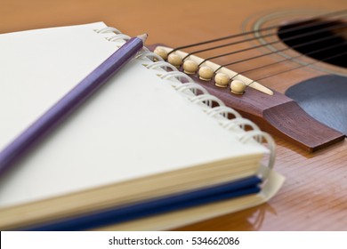 Guitar with blank page for composing and creativity music