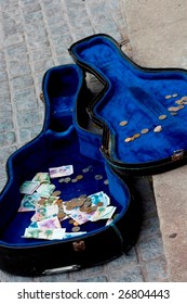 Guitar Case On The Street With Money In It