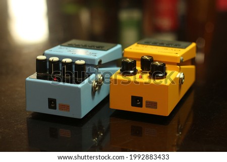 A guitar effect pedal is an electronic device that alters the sound of a musical instrument or other audio source through audio signal processing