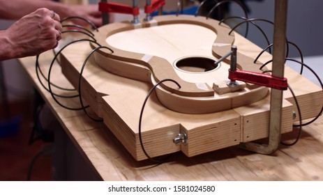 Guitar Maker Clamp Together The Acoustic Guitar Structure
