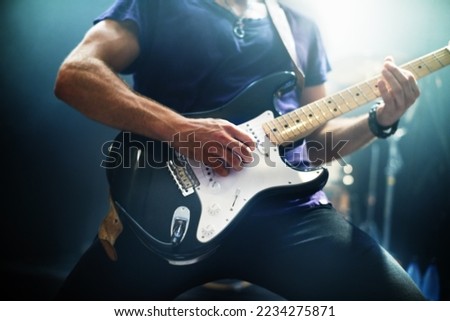 Guitar, man and performance at night, party and stage concert for punk, rock and heavy metal music festival. Electric guitarist, hands and musician, artist and band at live event, show and nightclub