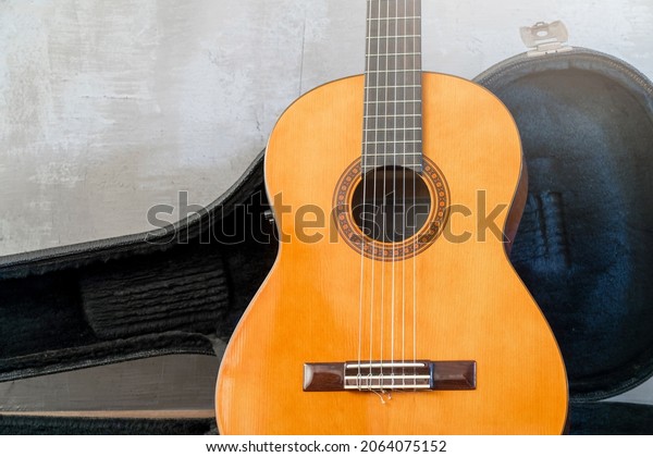Guitar on\
hard Case .Classic acoustic guitar\
concept.